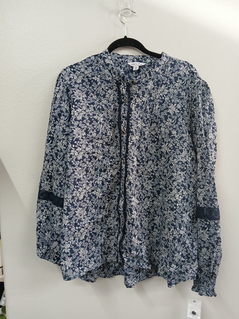 Ophelia Roe blouse features a navy and white floral print 3X